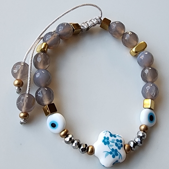 Elegant Beaded Bracelet with Floral Charm - Picture 2 of 5